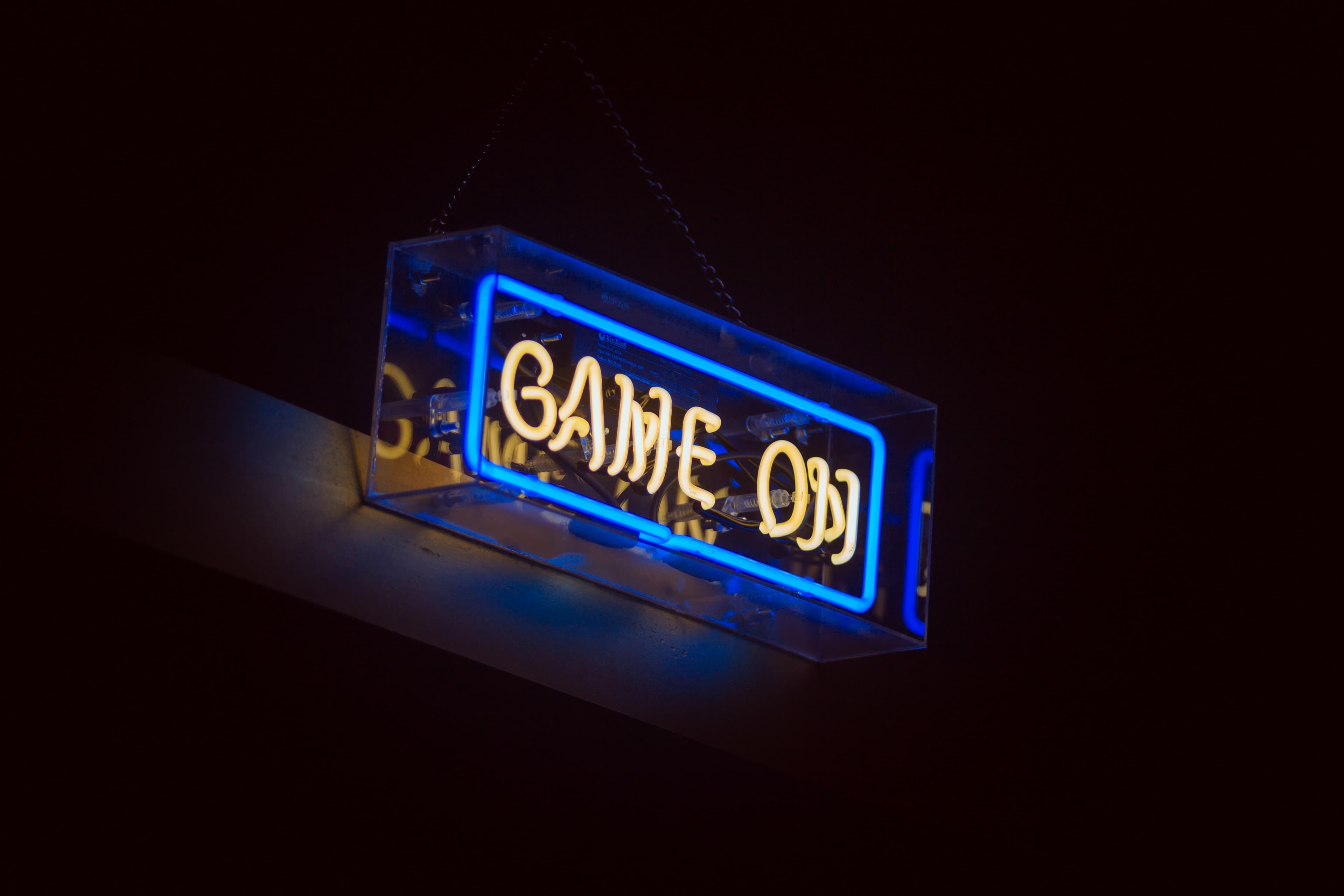 A GAME ON neon sign lit up