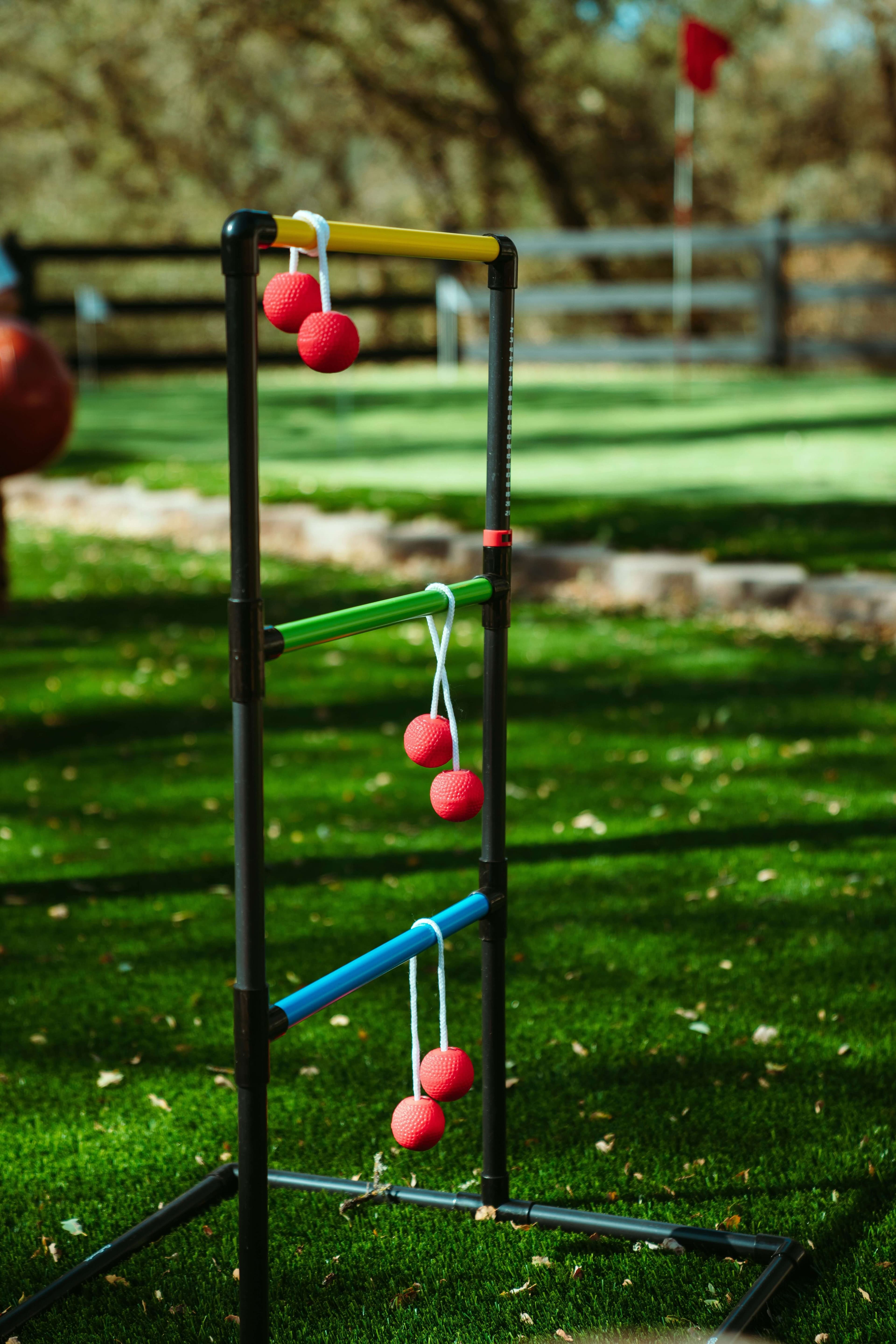 A giant outdoor game frame set up on a grass lawn